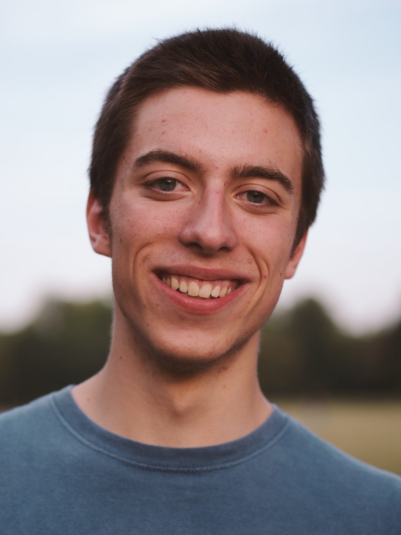 close up portrait of a teenage young male student